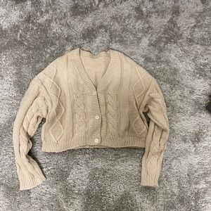 Cream cardigan. Very warm and in good condition.
